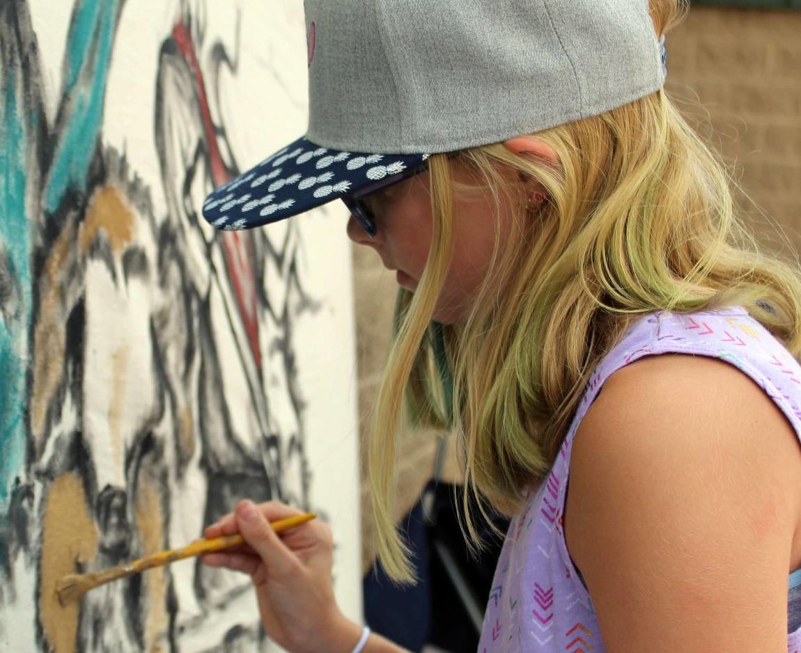 Megan paints mural
